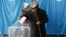 Kazakhstabn -- People vote during a snap parliamentary election in a village of Toretam, southern Kazakhstan, March 20, 2016