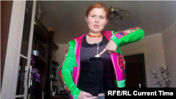 Ukrainian liver transplant patient Anya shows the bandage for the liver transplant she received in Minsk, Belarus.