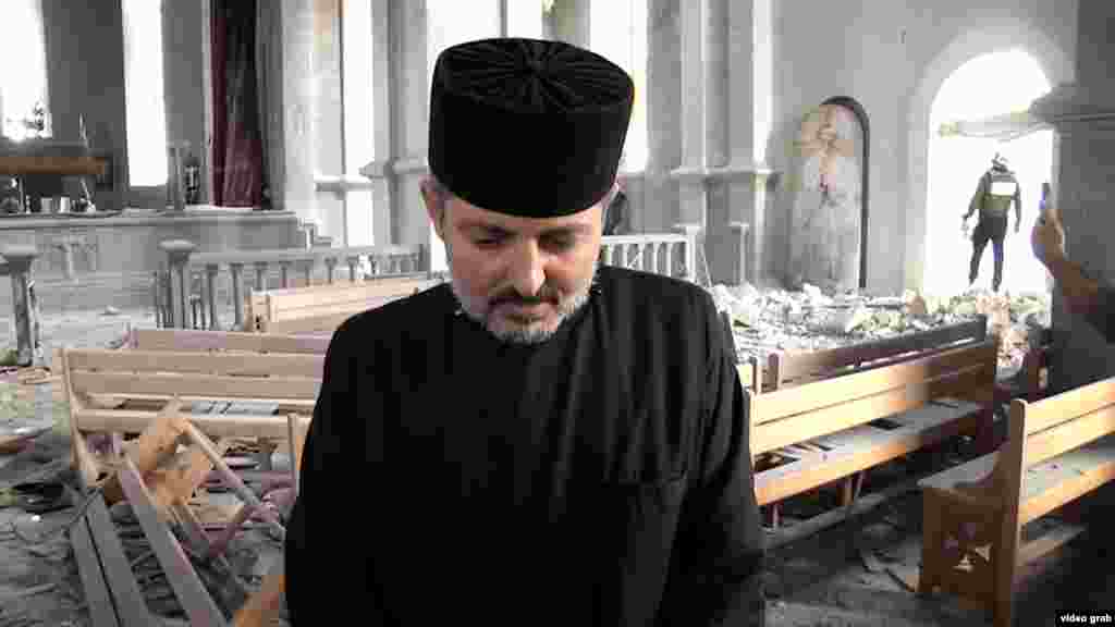 A priest inside the damaged Ghazanchetsots Cathedral, a 19th-century Armenian Apostolic church in the Karabakhi town of Shushi, called Shusha in Azerbaijani.&nbsp;&nbsp;