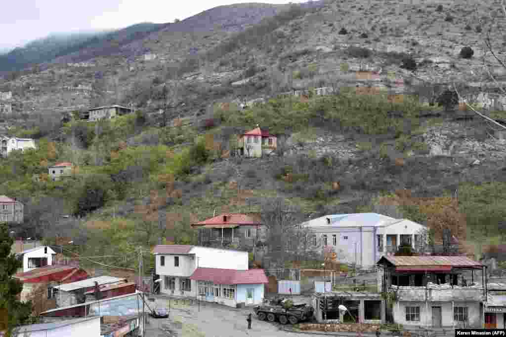 Russian peacekeepers are seen at a checkpoint in the town of Lachin (called Berdzor in Armenian) on December 1, 2020, the day Azerbaijan officially regained control of the town from Armenian forces after more than 28 years. A sleepy regional seat with an estimated population of less than a few thousand, Lachin holds immense strategic value. It sits on one of two working roads that connect breakaway Nagorno-Karabakh to Armenia.&nbsp;