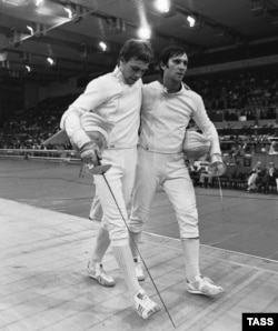 The USSR's fencing gold medalist Viktor Krovopuskov (right) and silver medalist Mikhail Burtsev at the 1980 Moscow Olympics
