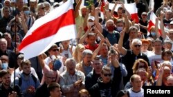 Thousands gathered in Minsk on August 15, 2020 for the funeral of protester Alyaksandr Taraykovski, who was killed during August 10 street demonstrations in the Belarusian capital against Belarus' presidential election results.