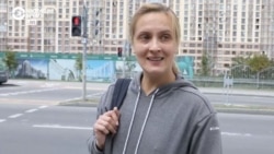 Belarus 1 news correspondent Antonina Stankevich speaking with women protesting police violence outside of Belarus' state broadcasting headquarters on August 13, 2020