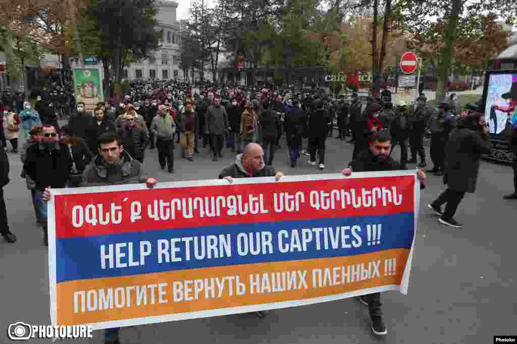 Armenian intellectuals march to the Russian Embassy in Yerevan on November 29, 2020 to demand Russia&#39;s help in locating missing Armenian soldiers and to call for Azerbaijan to return all prisoners. Petitions also have been made to the French and U.S. embassies. Ordinary Azerbaijanis also have been struggling to receive information from their defense ministry about the status of missing relatives.&nbsp; Russian Foreign Minister Sergei Lavrov has underlined that Russian peacekeepers are assigned to facilitate the exchange of bodies and prisoners, but noted on December 1, 2020 the need for an exact list of who is missing. &nbsp;