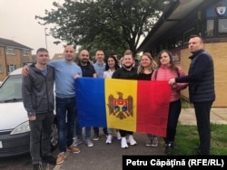 Moldovan diaspora members in Northampton, the United Kingdom gather at a polling station for Moldova's July 11, 2021 parliamentary vote.