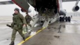 Russian armed service members, part of a Collective Security Treaty Organization peacekeeping mission, arrive in Kazakhstan on January 7, 2022. 