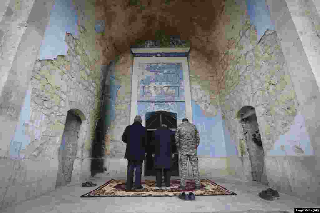 NAGORNO-KARABAKH -- Azerbaijanian religion officials and military officer pray in Mosque in Aghdam, after the Azerbaijani forces handed control that had been occupied by Armenian forces for a quarter-century, Aghdam, November 20, 2020