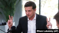 Ukrainian President Volodymyr Zelenskiy speaks  with journalists in Kyiv on October 10, 2019.