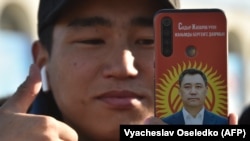  A supporter of Kyrgyz presidential candidate Sadyr Japarov attends a January 11, 2021 rally on Ala-Too Square in Bishkek, capital of Kyrgyzstan. 