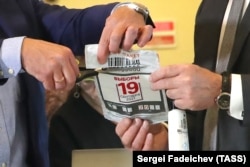 Encryption keys are put together at the Central Election Commission's information center to count online votes in Russia's 2021 elections.