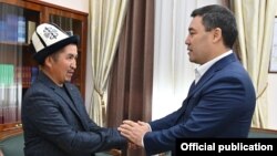 Altynbek Jumataev, father of slain 2020 protester Umutbek Altynbek ulu, meets Kyrgyz President Sadyr Japarov on October 5, 2021.