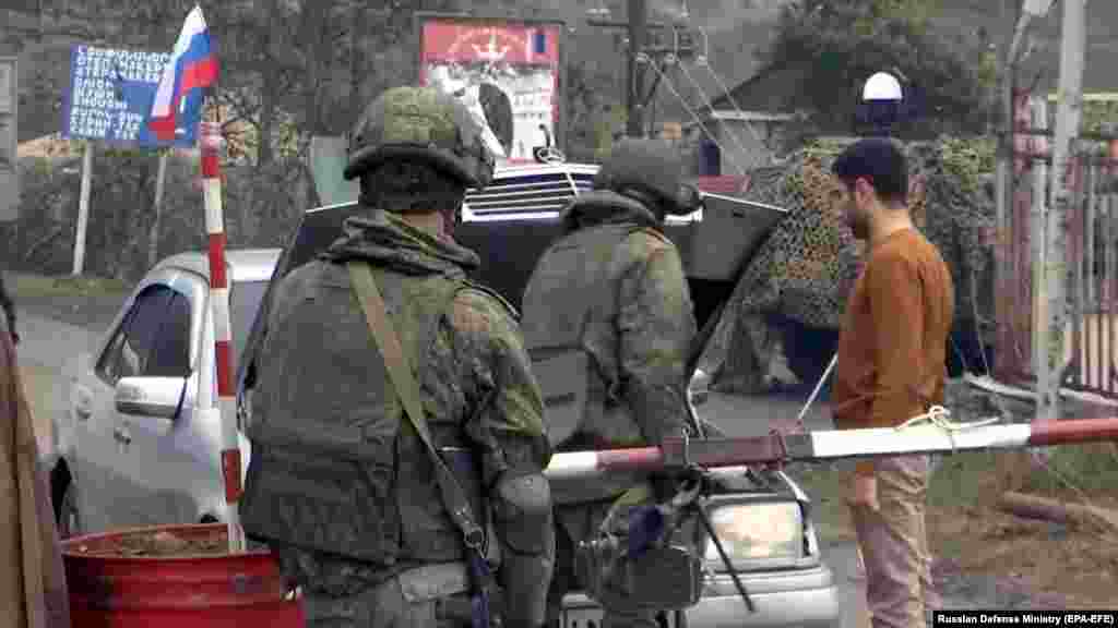 NAGORNO-KARABAKH -- Russian peacekeeper schecking a car at a checkpoint in the Lachin Corridor, November 19, 2020