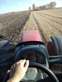 Aleksandra Besparova at the wheel of a tractor. Photo: Aleksandra Besparova archive