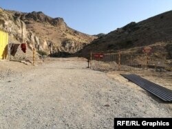 A metal gate bars entrance to the Shovvozsoy "vacation area"