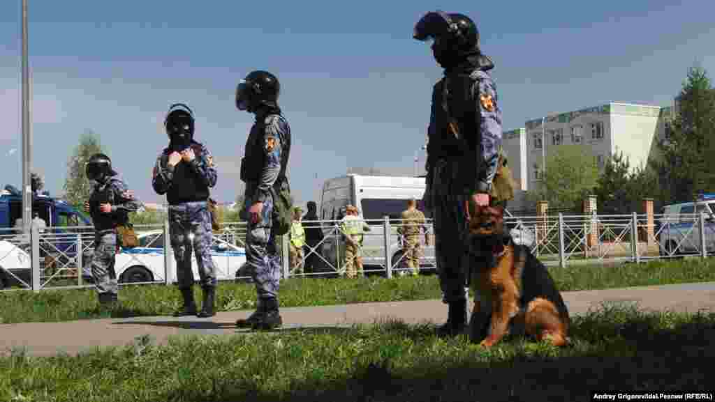 For additional security, law enforcement stand in the vicinity of School No. 175 on May 11, 2021. Russian President Vladimir Putin has called for tighter regulations on the private ownership of guns similar to that used in the attack. The type has not been specified, but gun owners in the region are being scrutinized, AP reported.&nbsp;