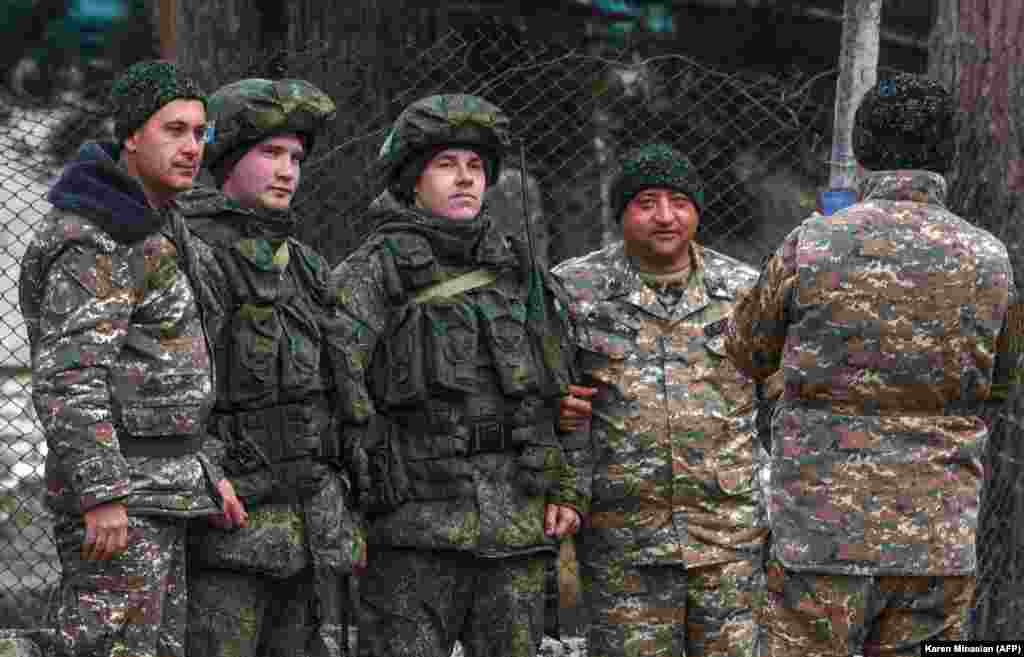 Over the past few weeks, posing for photos with Russian peacekeepers has become a standard pastime for Azerbaijani and Armenian servicemen alike. Here, Armenian soldiers are featured with two Russian peacekeepers (center) two days before the return of Azerbaijani troops to the town of Kalbacar (Karvachar in Armenian) on November 25, 2020. The Kalbacar region was the second territory restored to Azerbaijani control under Armenia, Azerbaijan, and Russia&#39;s November 9, 2020 ceasefire agreement.
