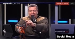 TV host Vladimir Solovyov pretends to battle with a Binocle on his Solovyov Live YouTube channel.