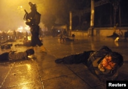 Georgian police detain protesters during brutal clashes in Tbilisi on May 26, 2011 that left dozens wounded and two men dead.