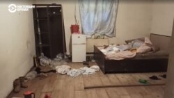 A room inside the Bishkek building identified in the case as a brothel. A police seal formerly on the building's door had been removed.