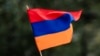 TOPSHOT - A child waves an Armenian flag as Armenians protest against Azerbaijan's offensive in Nagorno-Karabakh, at Place du Canada in Montreal, Quebec, Canada, on October 1, 2023.