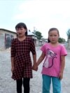 'Don't Cry': Growing Up In Kyrgyzstan With A Long-Distance Migrant Mom