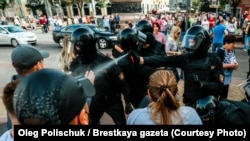 Riot police spray tear gas in the faces of protesters in Brest at a peaceful protest  against the government on September 20, 2020.