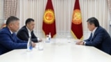 President Sooronbai Jeenbekov (right) meets with Kyrgyzstan's new parliamentary speaker, Kanat Isaev (front left), and prime minister, Sadyr Japarov, in Bishkek on  October 14, 2020.