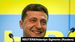 Ukraine's President Volodymyr Zelenskiy speaks at his party's headquarters after the July 21, 2019 parliamentary elections. 