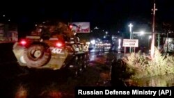 Russian military vehicles enter Stepanakert (Khankendi), the main town in the disputed region of Nagorno Karabakh, on November 12, 2020.