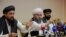 Taliban representatives Abdul Latif Mansoor (left), Shahabuddin Delawar, and Suhail Shaheen attend a July 9, 2021 news conference in Moscow, Russia. 