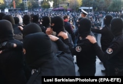 Armenian police officers during a November 13, 2020 rally against the Nagorno-Karabakh peace accord on Yerevan's Freedom Square.