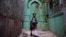 INDIA -- An Indian school girl walks in an alley in the old quarters of New Delhi, November 28, 2018